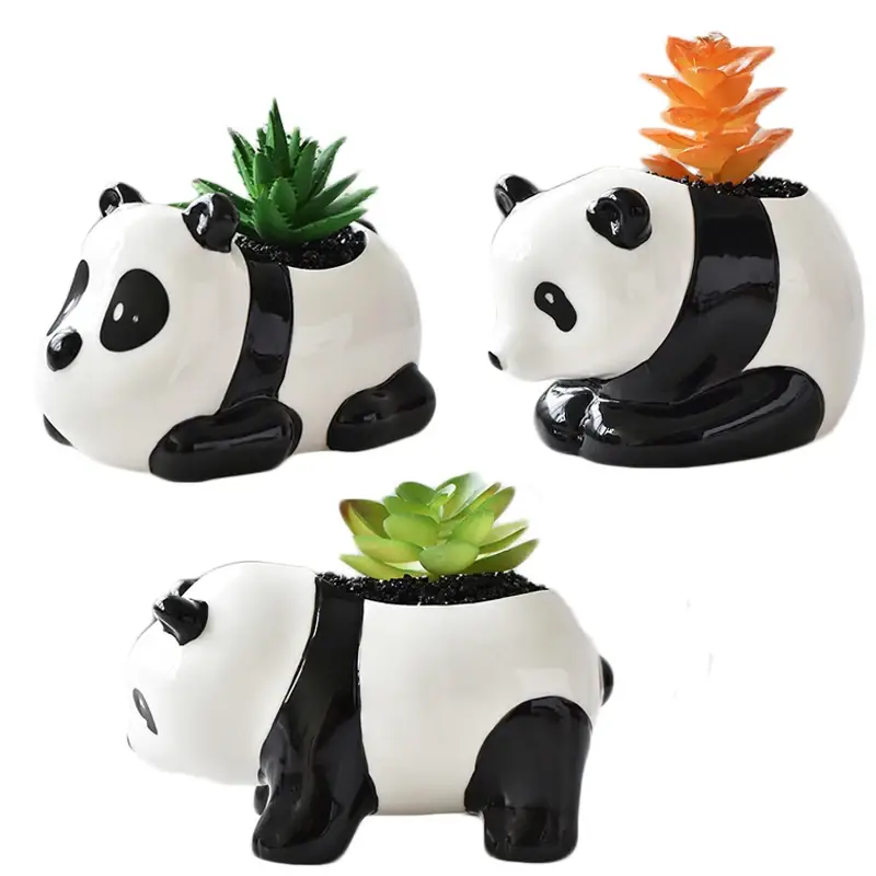three ceramic panda planters with plants in them