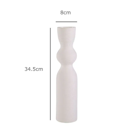 a white vase is shown with measurements