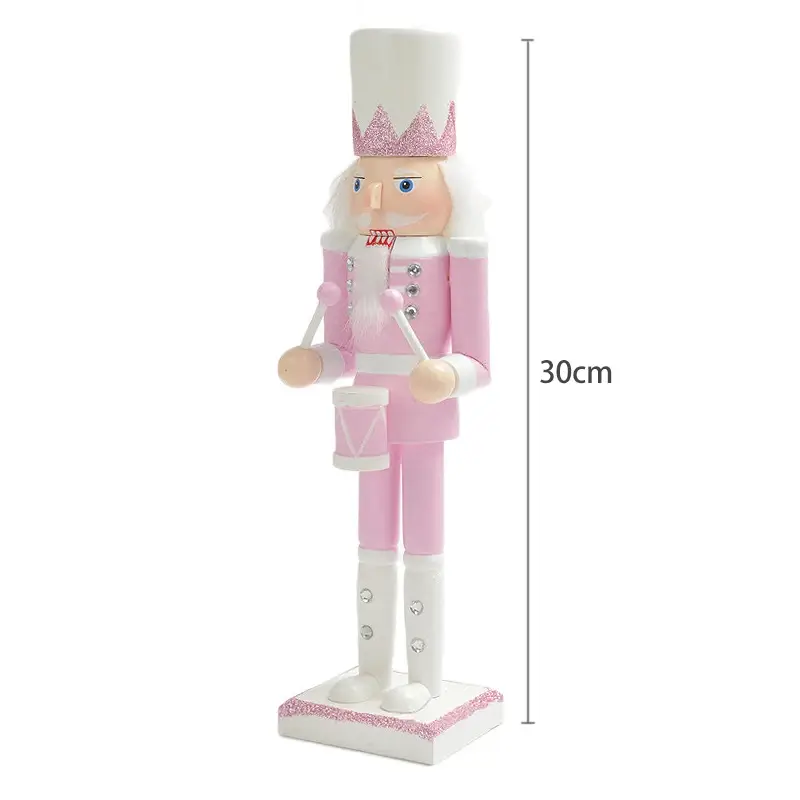 a pink and white nutcracker figurine on a white background