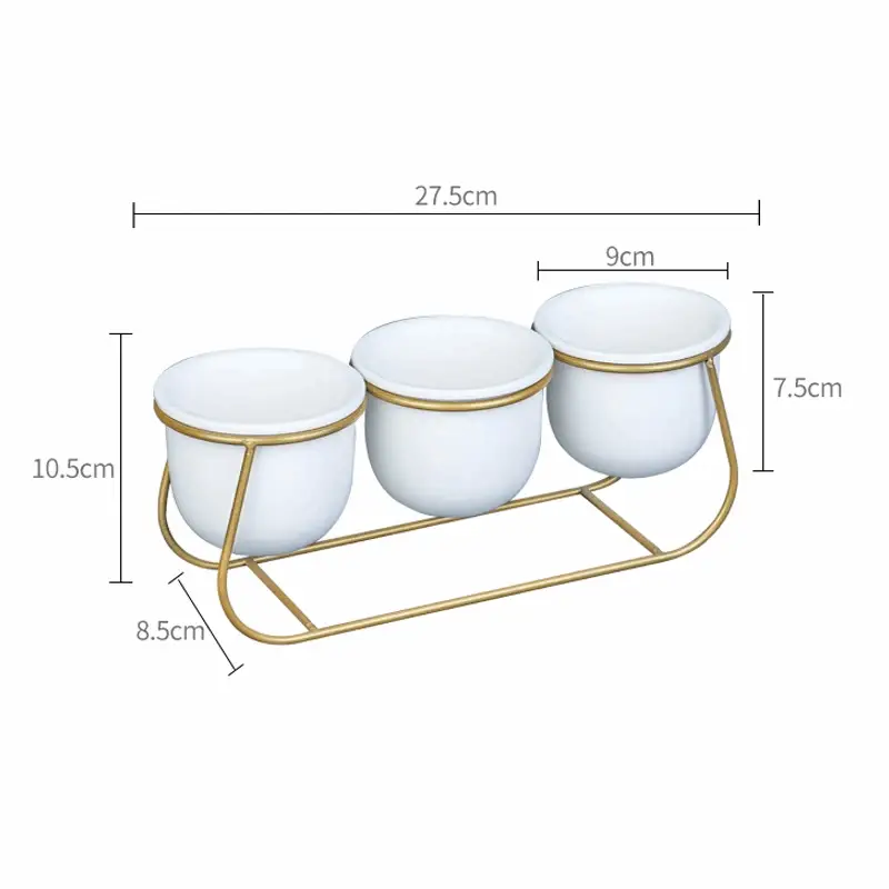 three white bowls on a gold stand with measurements
