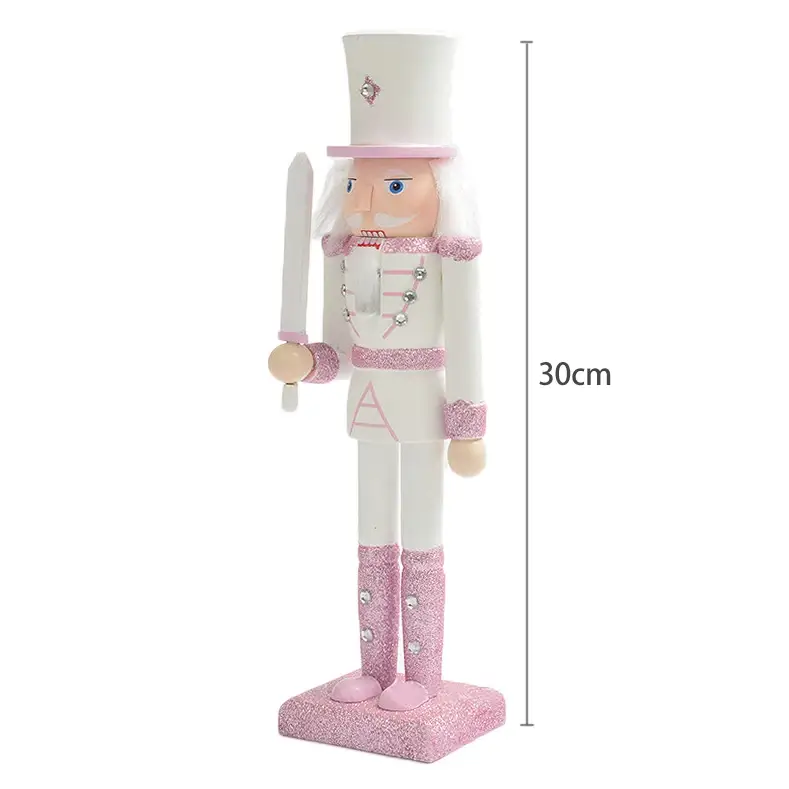 a pink and white wooden nutcracker figure