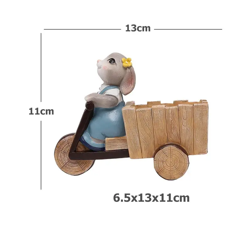 a wooden toy elephant riding on a wooden cart