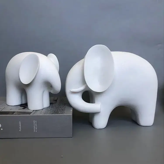 a couple of white elephants standing next to each other