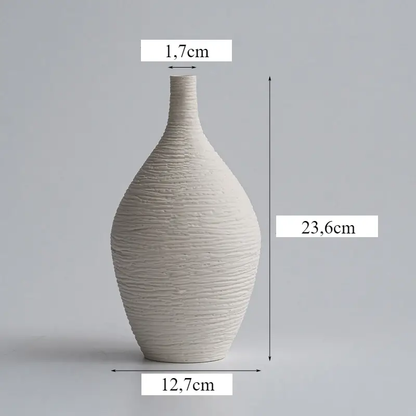 a white vase is shown with measurements for it