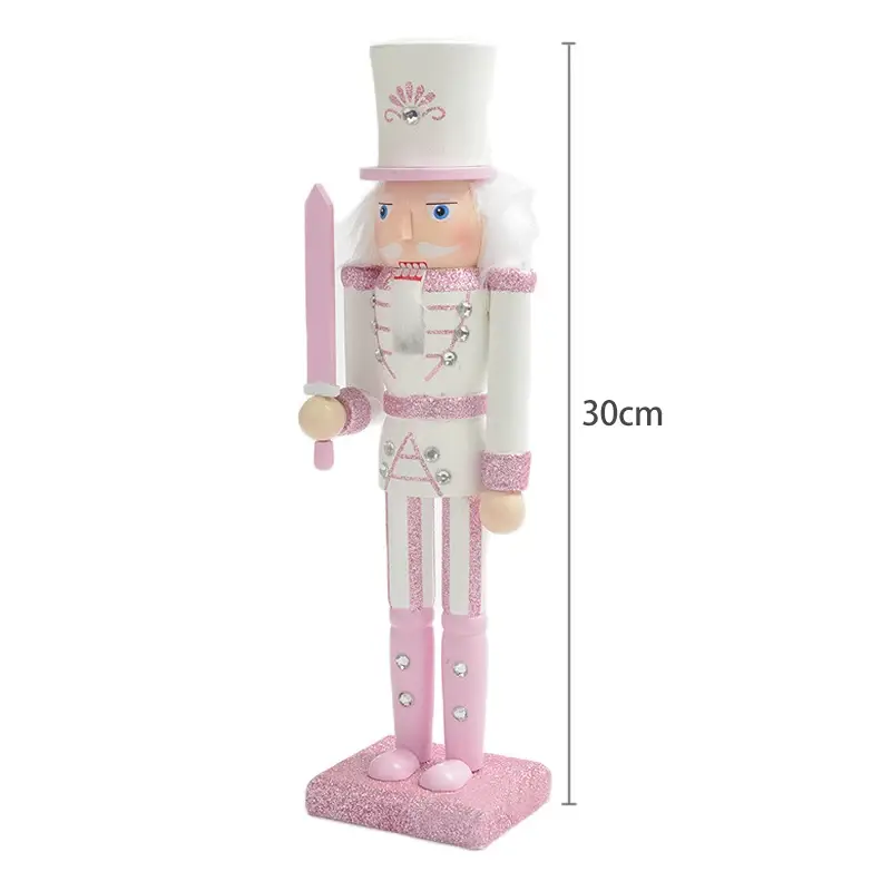 a pink and white nutcracker figurine on a white background