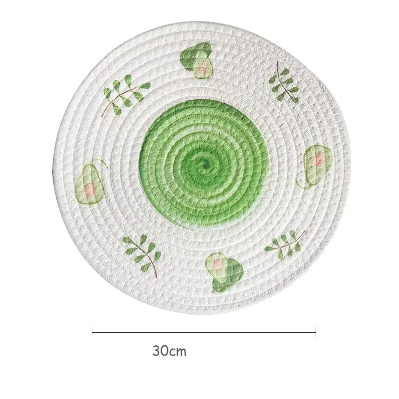 a green and white plate with leaves on it