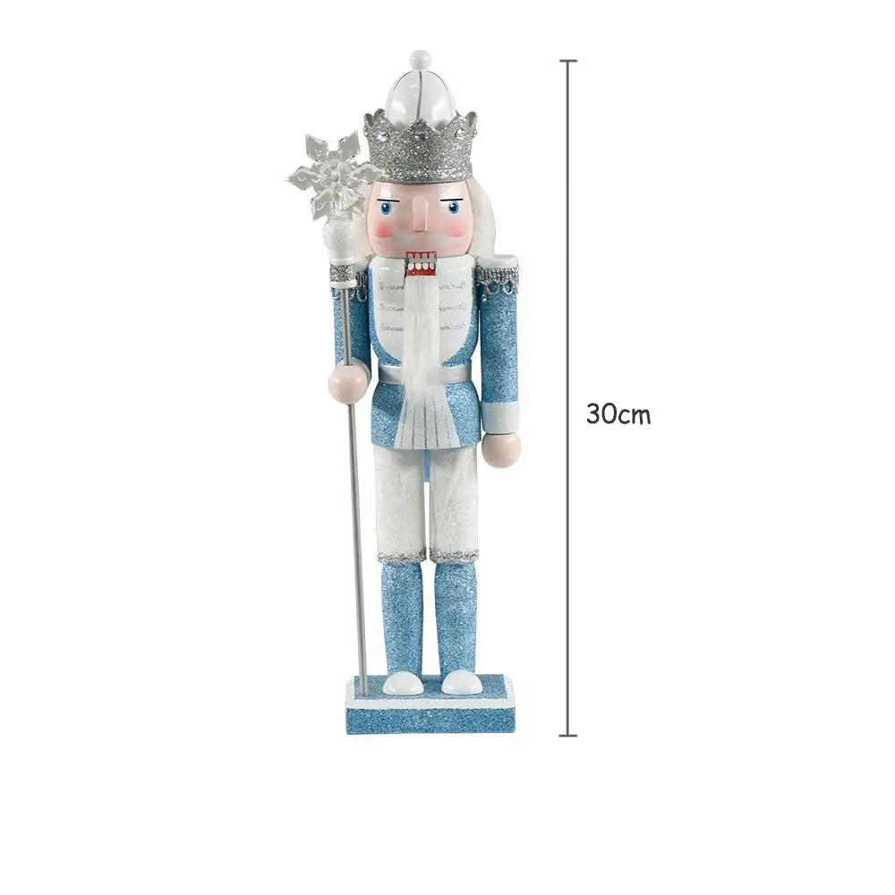 a blue and white nutcracker with a crown