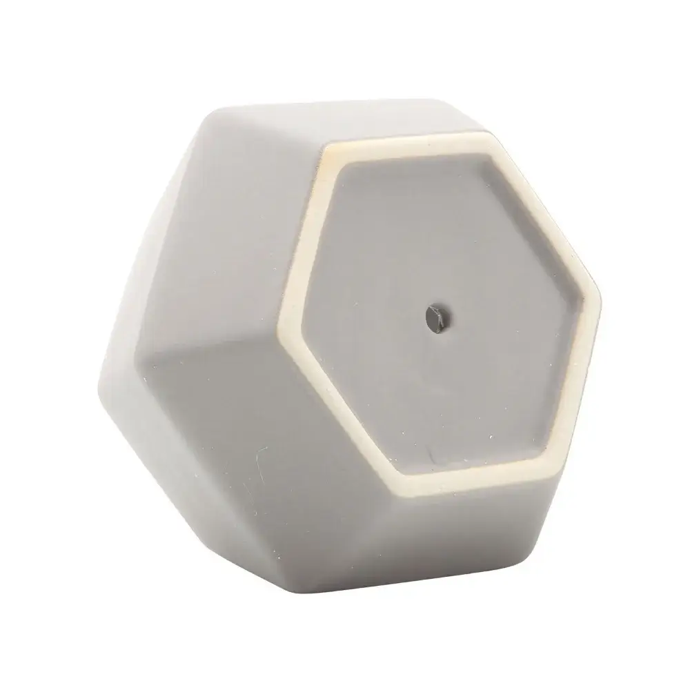 a white hexagonal object on a white background
