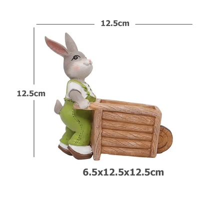 a toy rabbit riding a wooden sleigh