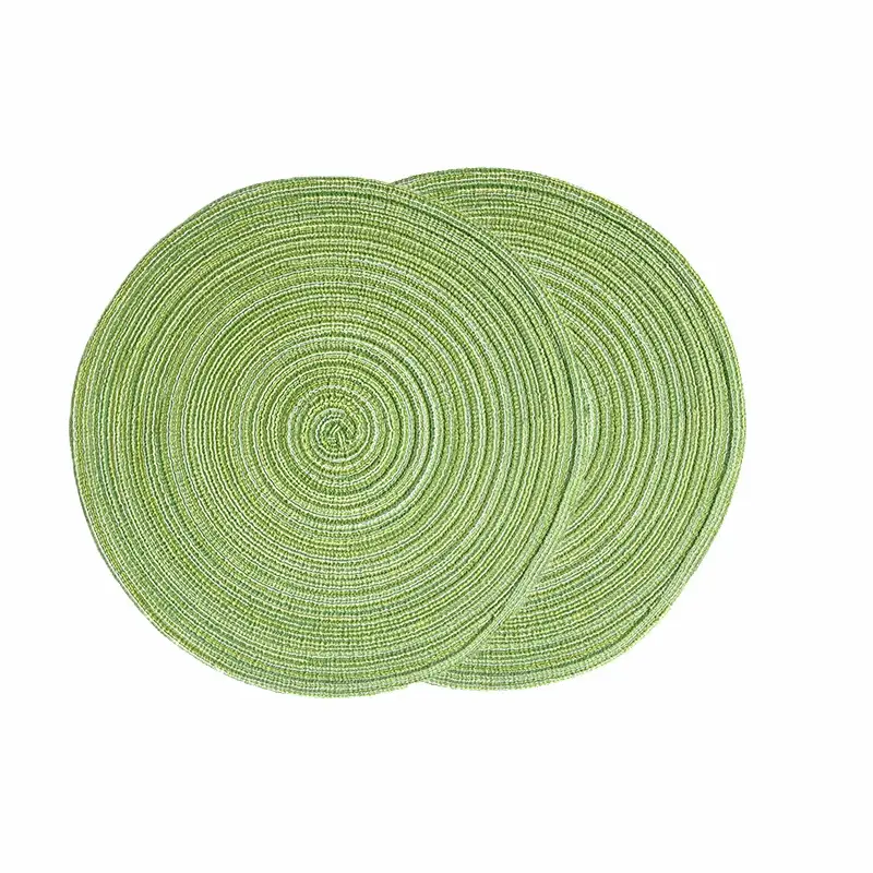 a pair of green placemats sitting on top of each other