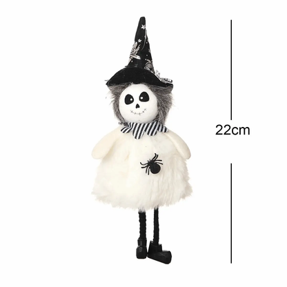 a stuffed animal wearing a witches hat