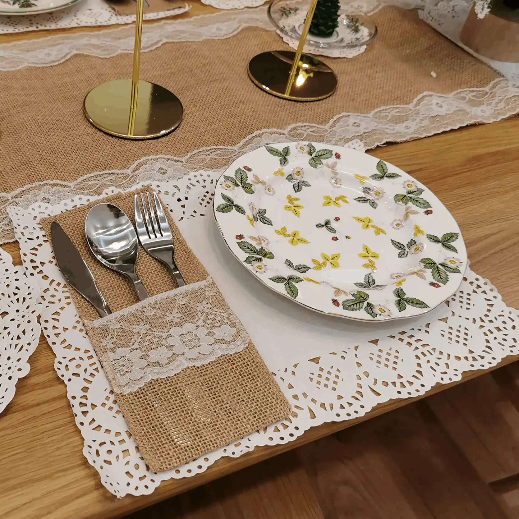 a table set with place settings and place mats