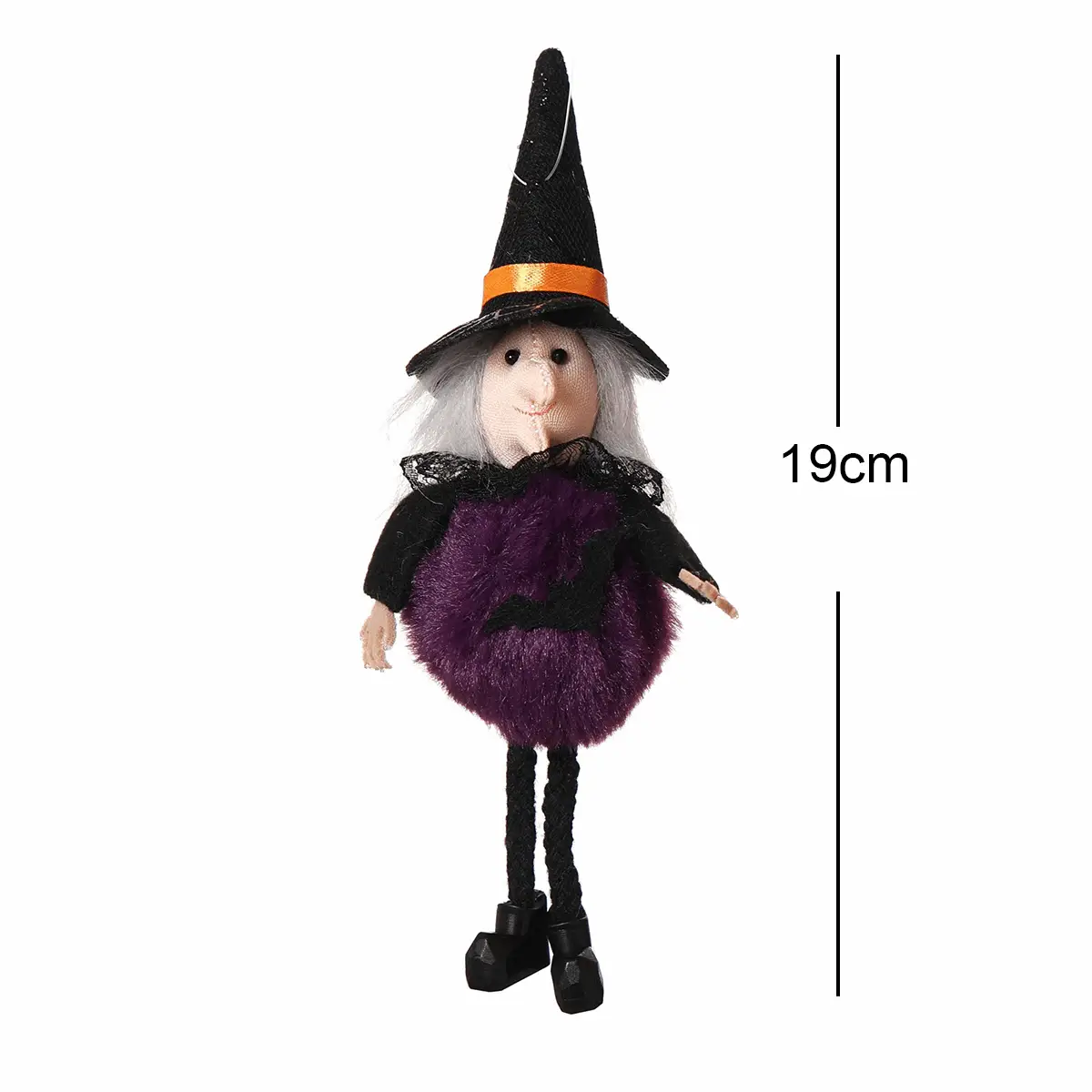a stuffed doll wearing a witches costume