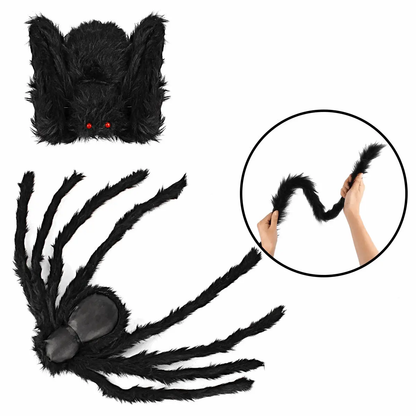 a hand holding a black spider costume with red eyes