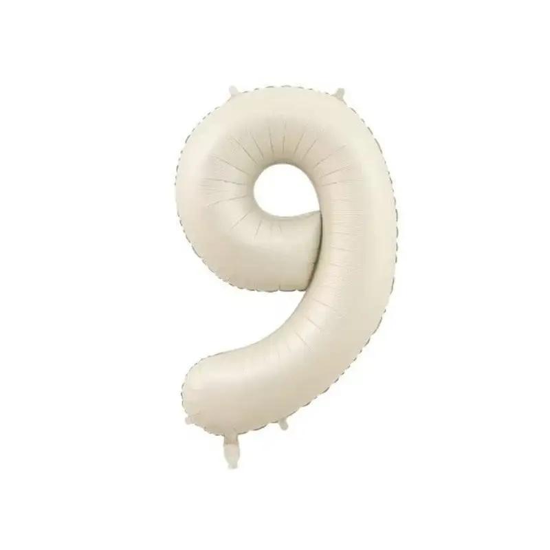 a white balloon shaped like the letter s