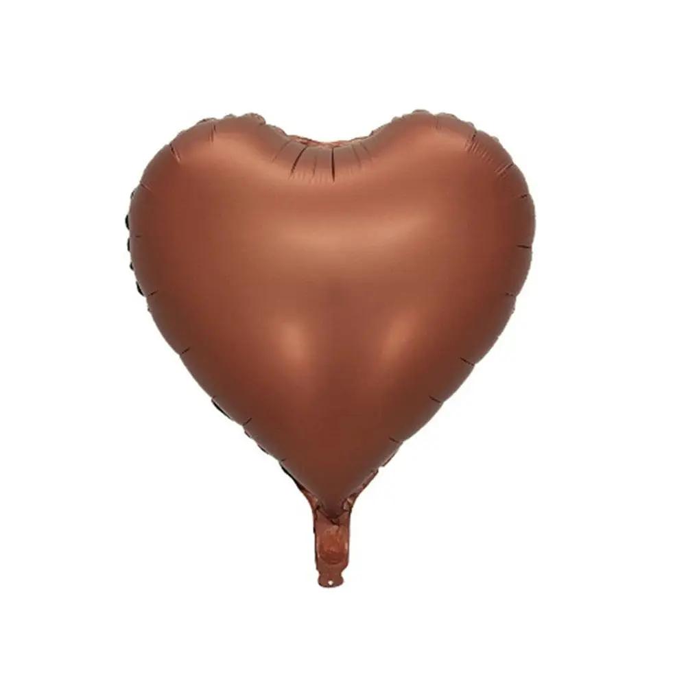 a heart shaped balloon floating in the air