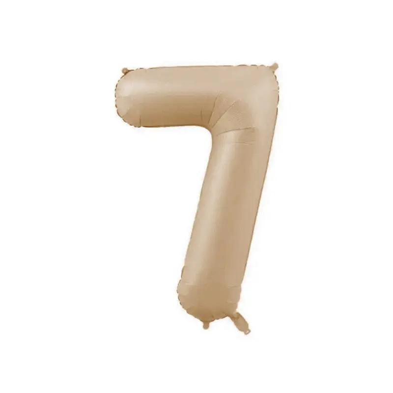 a tan number seven balloon on a white background