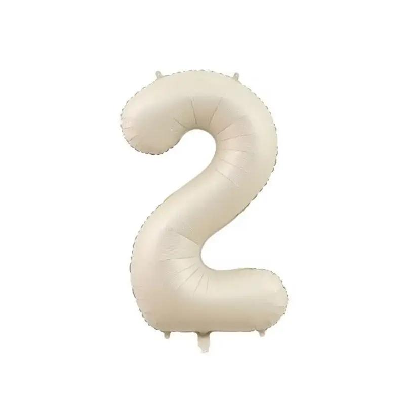a white balloon shaped like the number two