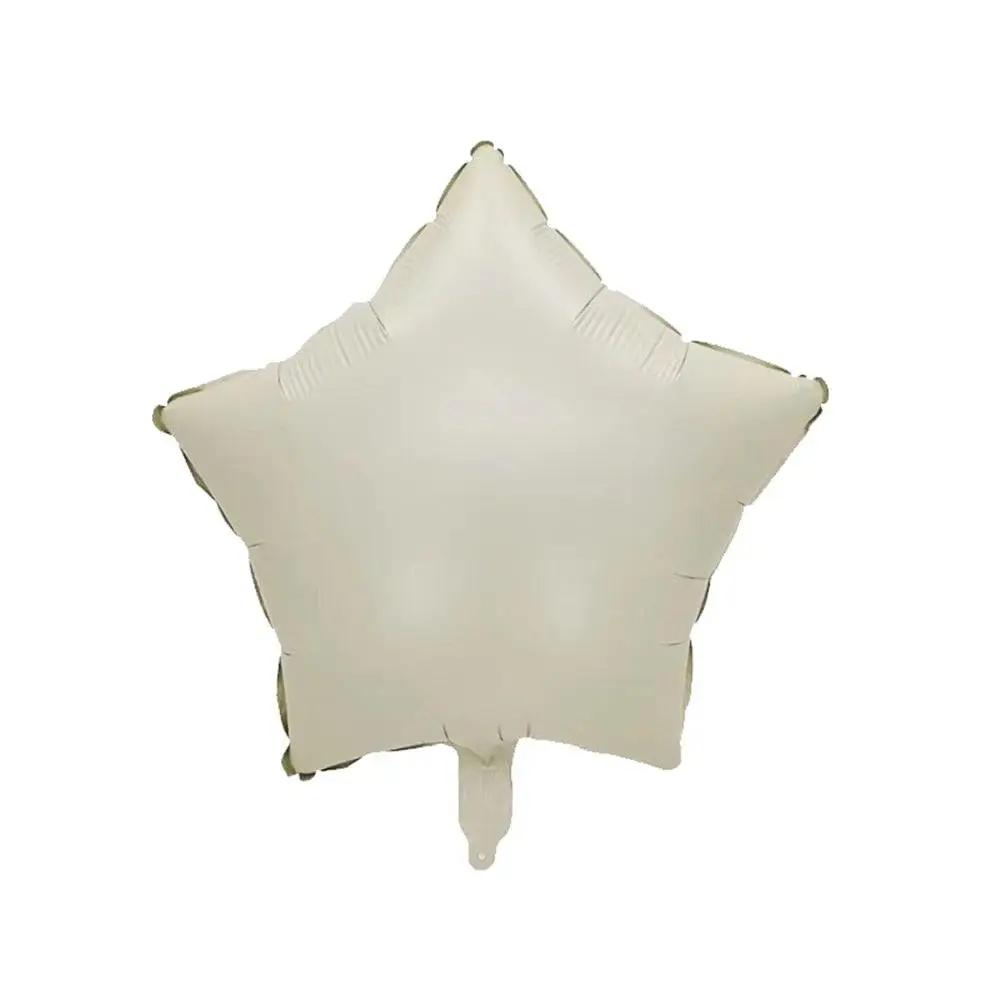 a white star shaped balloon on a white background
