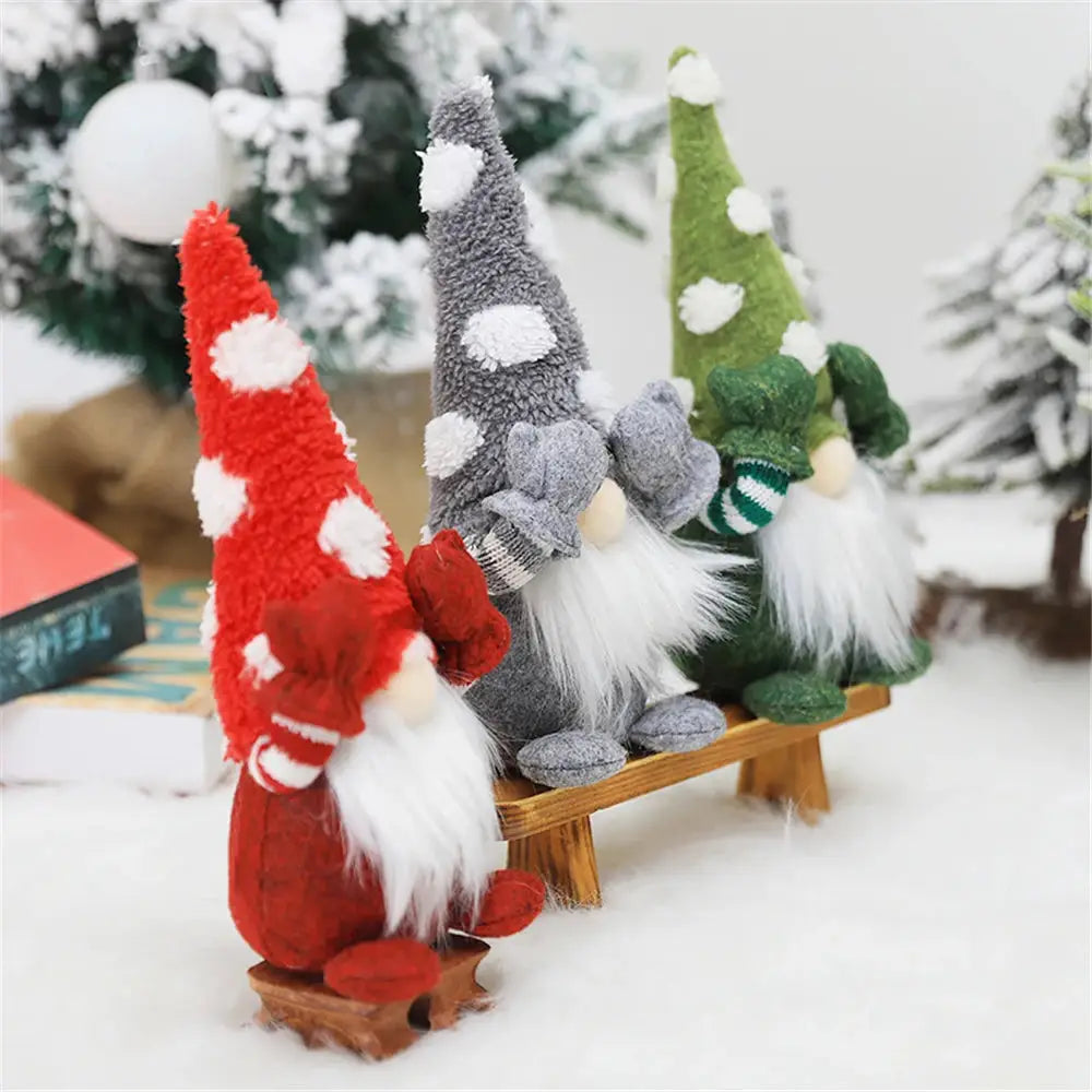 a group of gnomes sitting on a sled in the snow