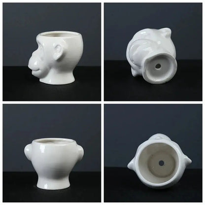 four pictures of a white vase with a bear's head on it