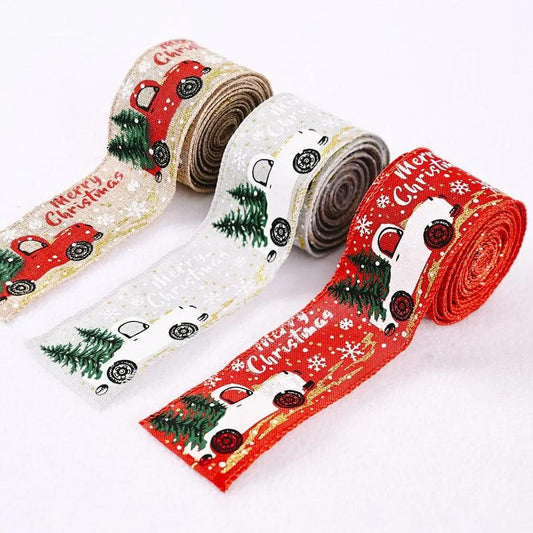 three rolls of christmas ribbon on a white background