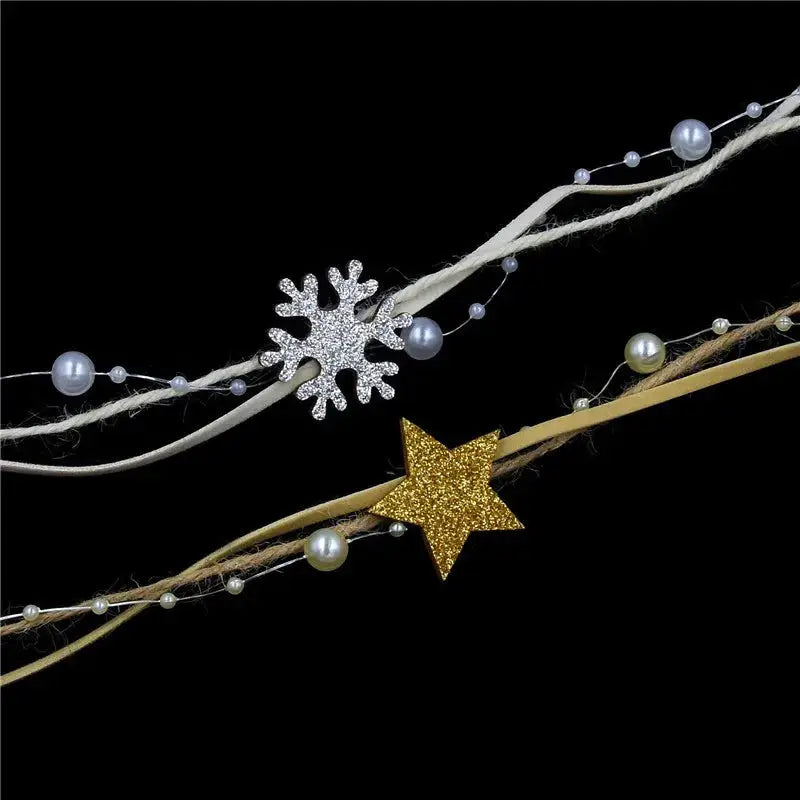 a gold and white snowflake on a black background