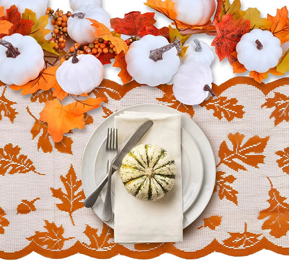 a white plate topped with a pumpkin next to a fork and knife