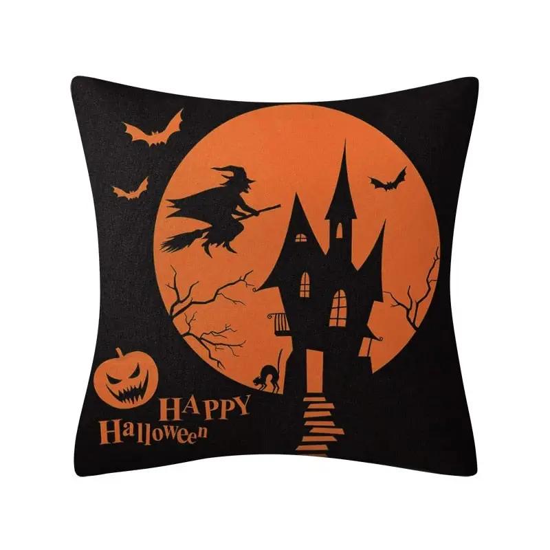 a black and orange pillow with a castle on it