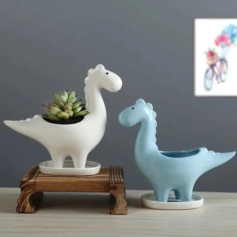 a couple of ceramic animals sitting on top of a table