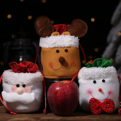 a group of stuffed animals sitting next to an apple