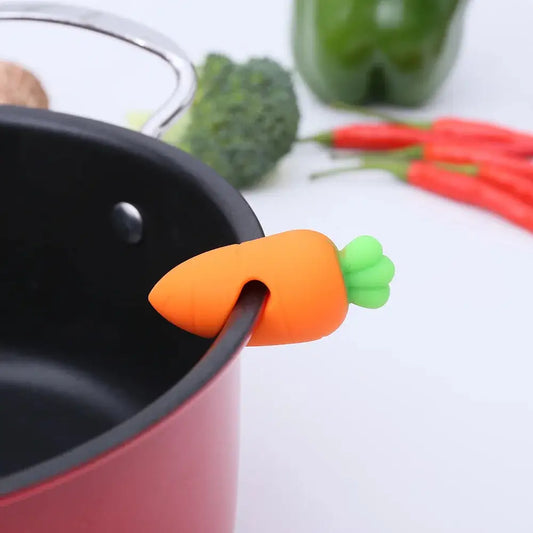 a toy carrot sticking out of a saucepan