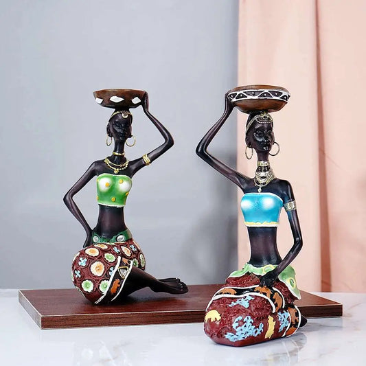 a couple of figurines sitting on top of a table