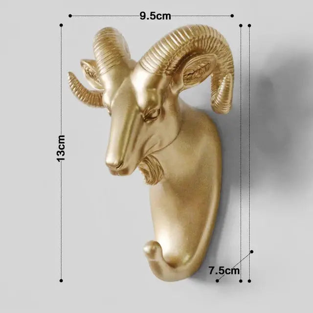 a golden ram head mounted on a wall