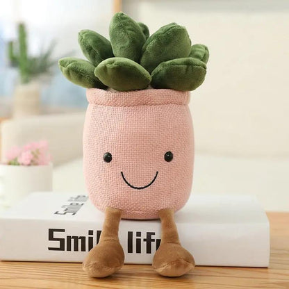 a stuffed planter with a smiling face on top of a book