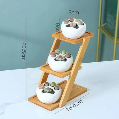 a three tiered wooden stand holding three bowls