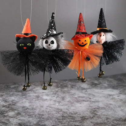 a group of halloween decorations hanging from strings