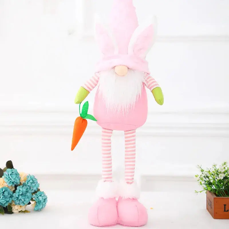 a stuffed toy with a pink outfit and carrot