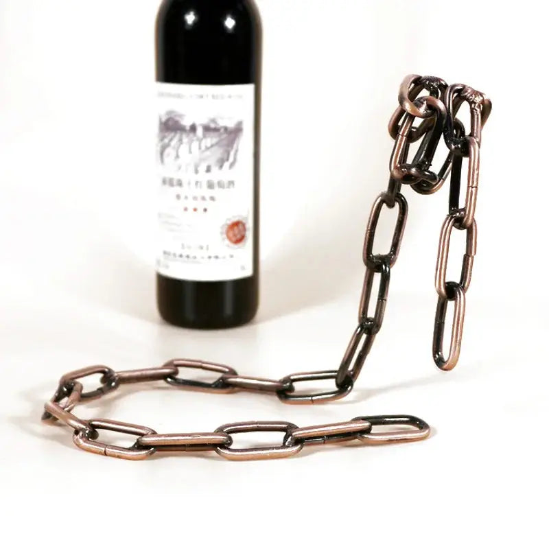 a bottle of wine is chained to a chain