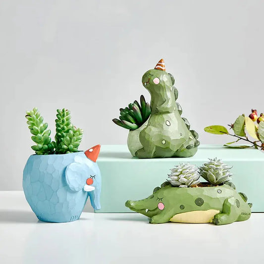 a group of ceramic animals sitting next to each other