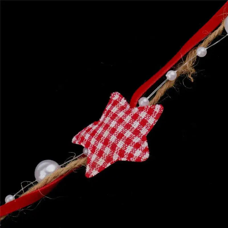a red and white checkered star on a string