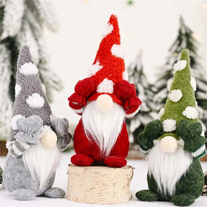 a group of three gnomes sitting next to each other