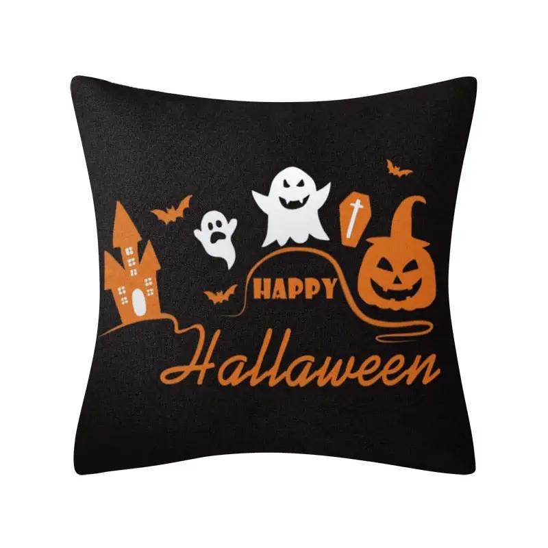a black pillow with a happy halloween message on it