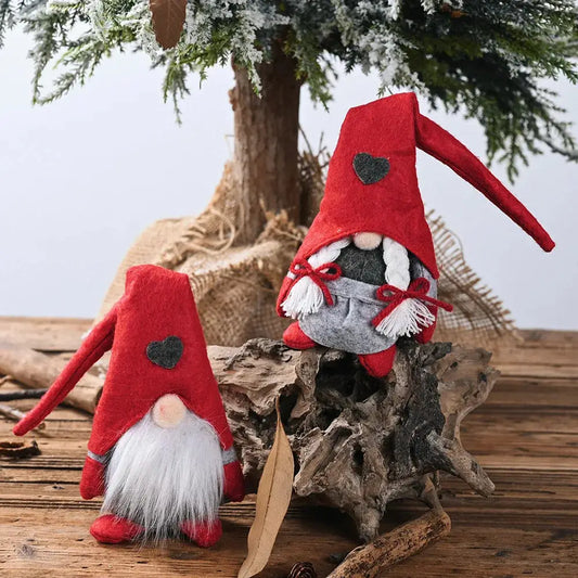 a couple of red and white gnomes sitting next to a tree