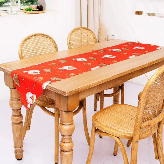 a wooden table with a red table cloth on it
