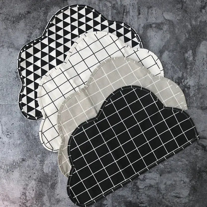 a group of three black and white place mats