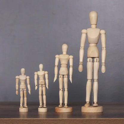a group of wooden mannequins on a table
