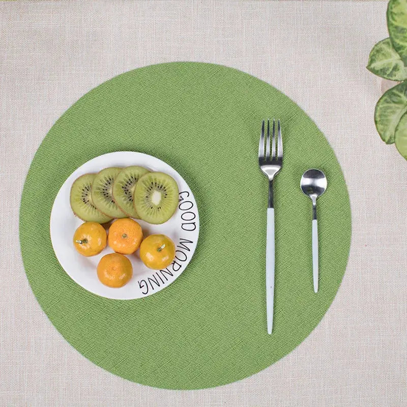 a plate with kiwis and oranges on it