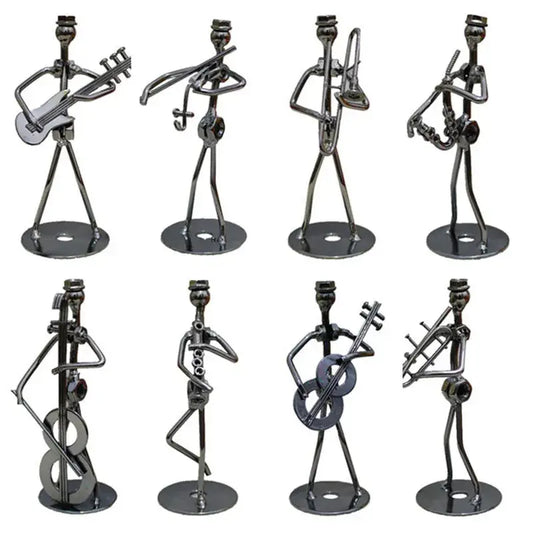 a group of metal sculptures of people with musical instruments