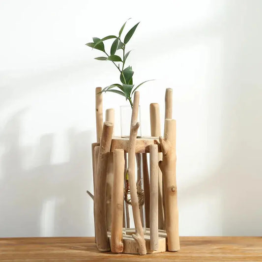 a wooden sculpture with a plant in it